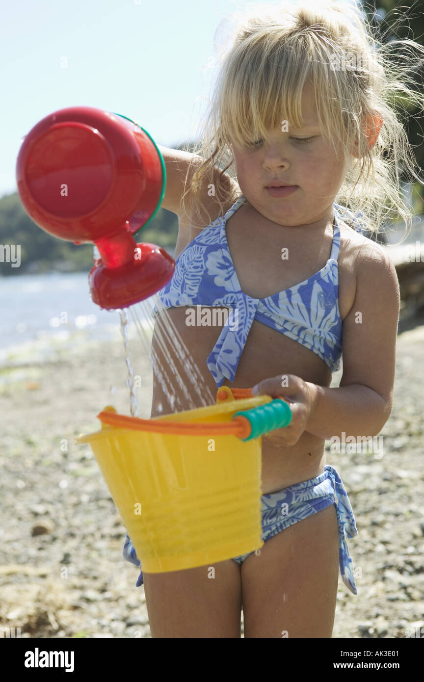 Young girl playing at the beach Stock Photo