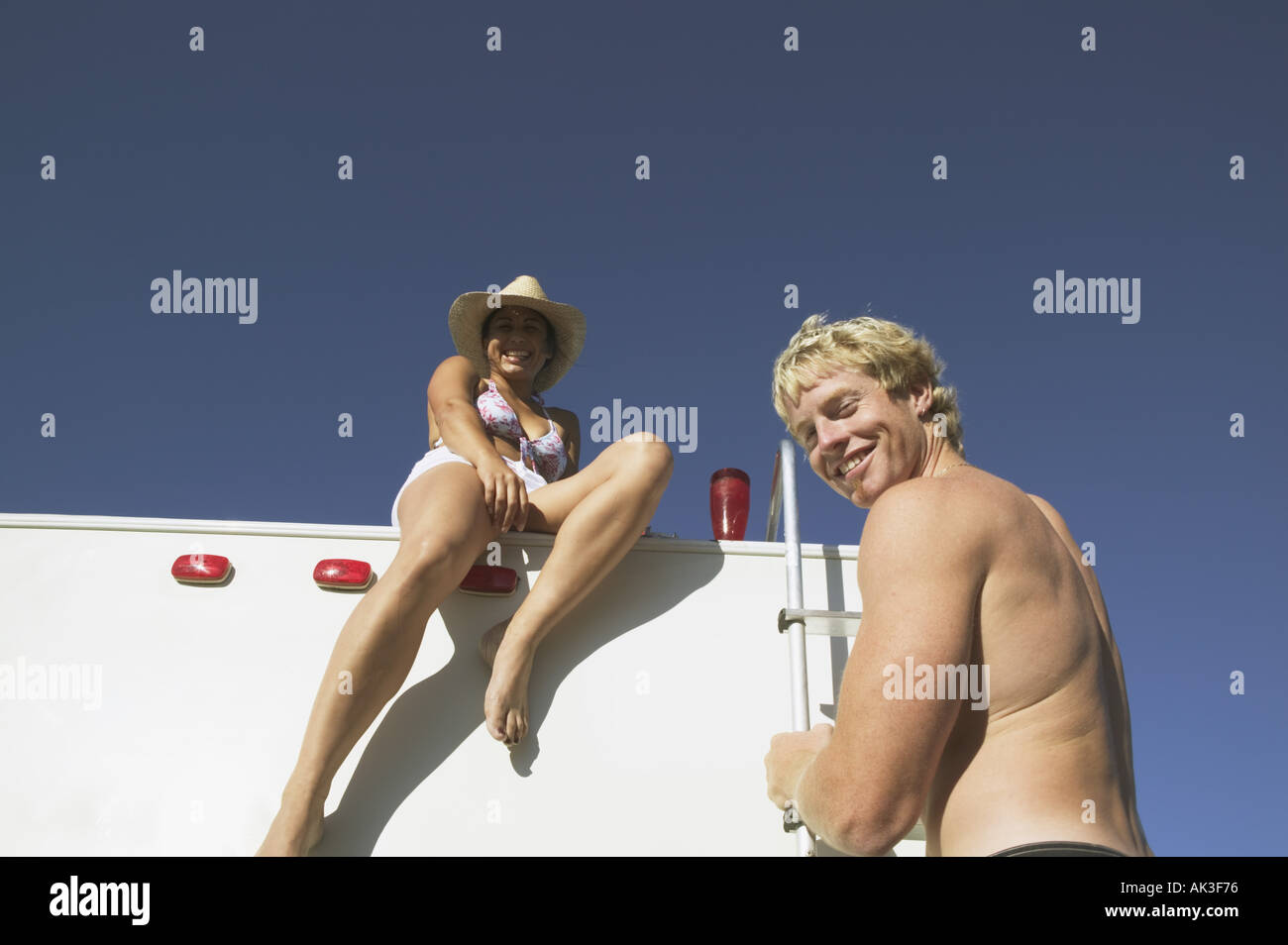 Couple hanging out on their motor home Stock Photo