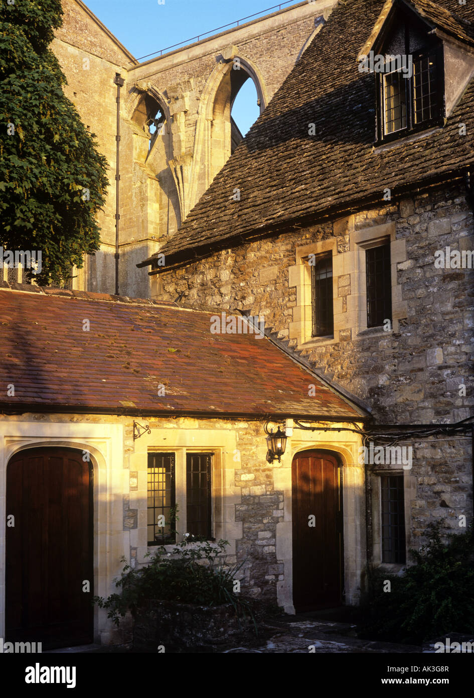 Remains of a medieval cathedral in Malmesbury and brick house Stock