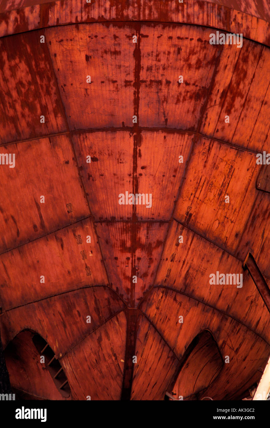 The rusty plates and rivets of a tugboat await restoration Stock Photo