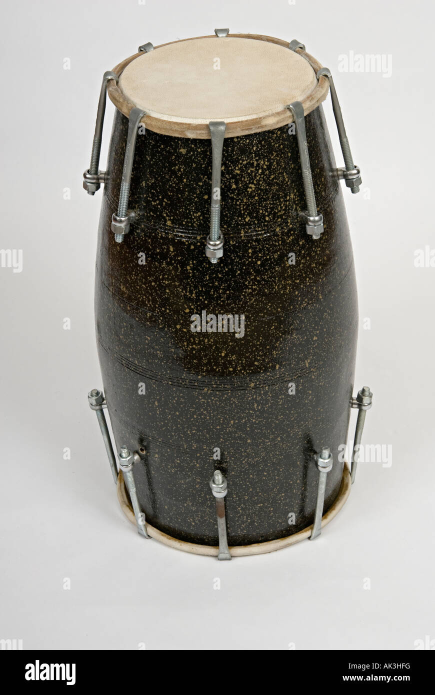 large dhol drums on a white background often used by indian bhangra drummers Stock Photo