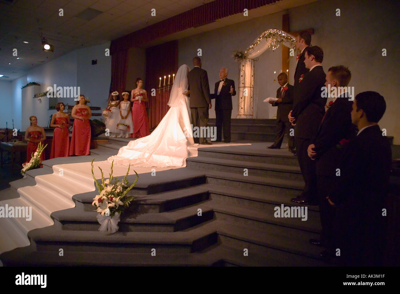 A white minister presides at the wedding of a mixed race bride and an