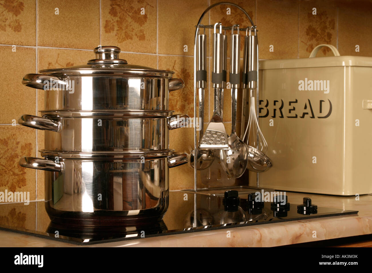 Steamer Saucepans cooking food on an electric hob Stock Photo Alamy