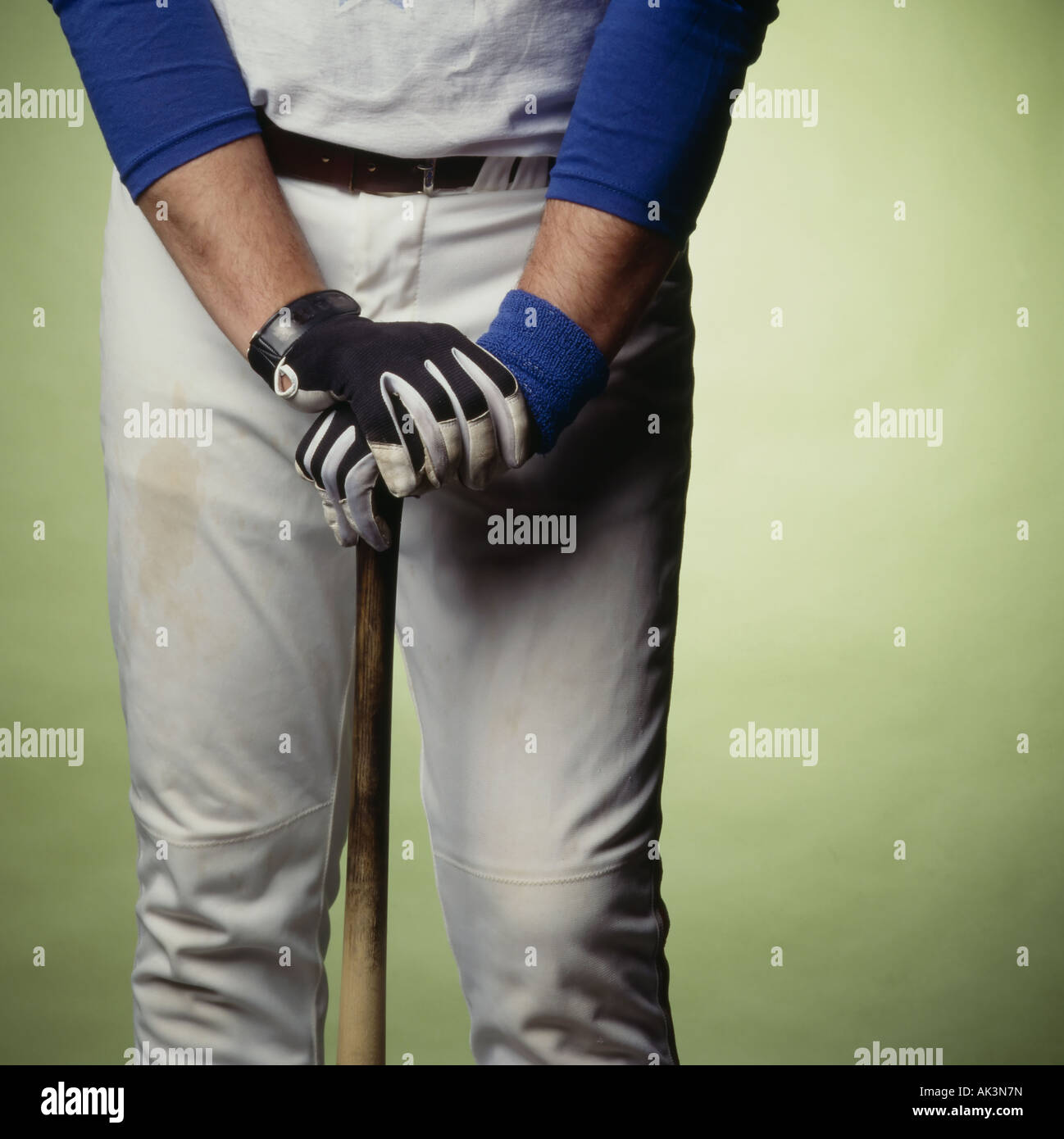 baseball player leaning on bat Stock Photo Alamy