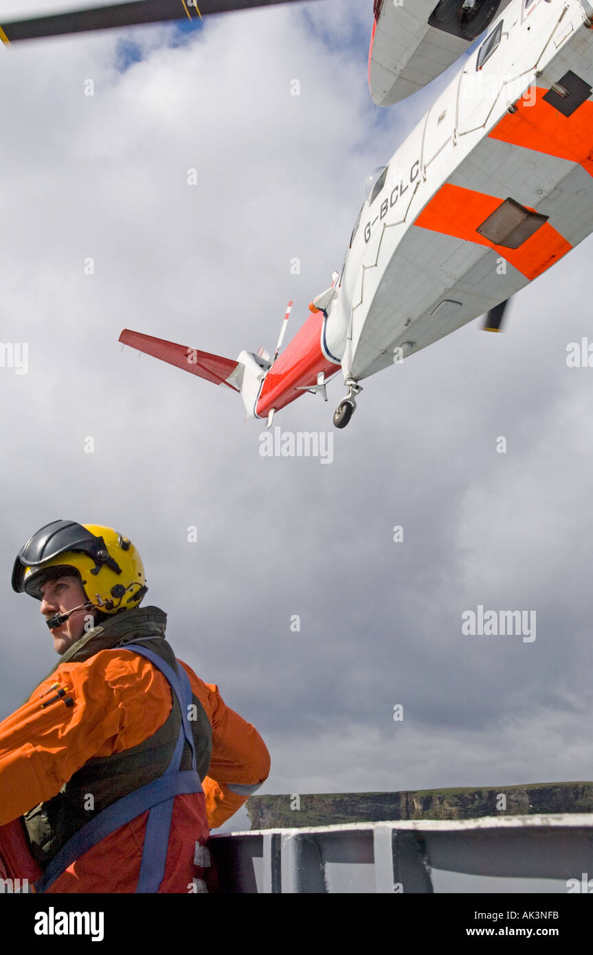 Coastguard Rescue Helicopter winchman being lowered Shetland Scotland UK Stock Photo