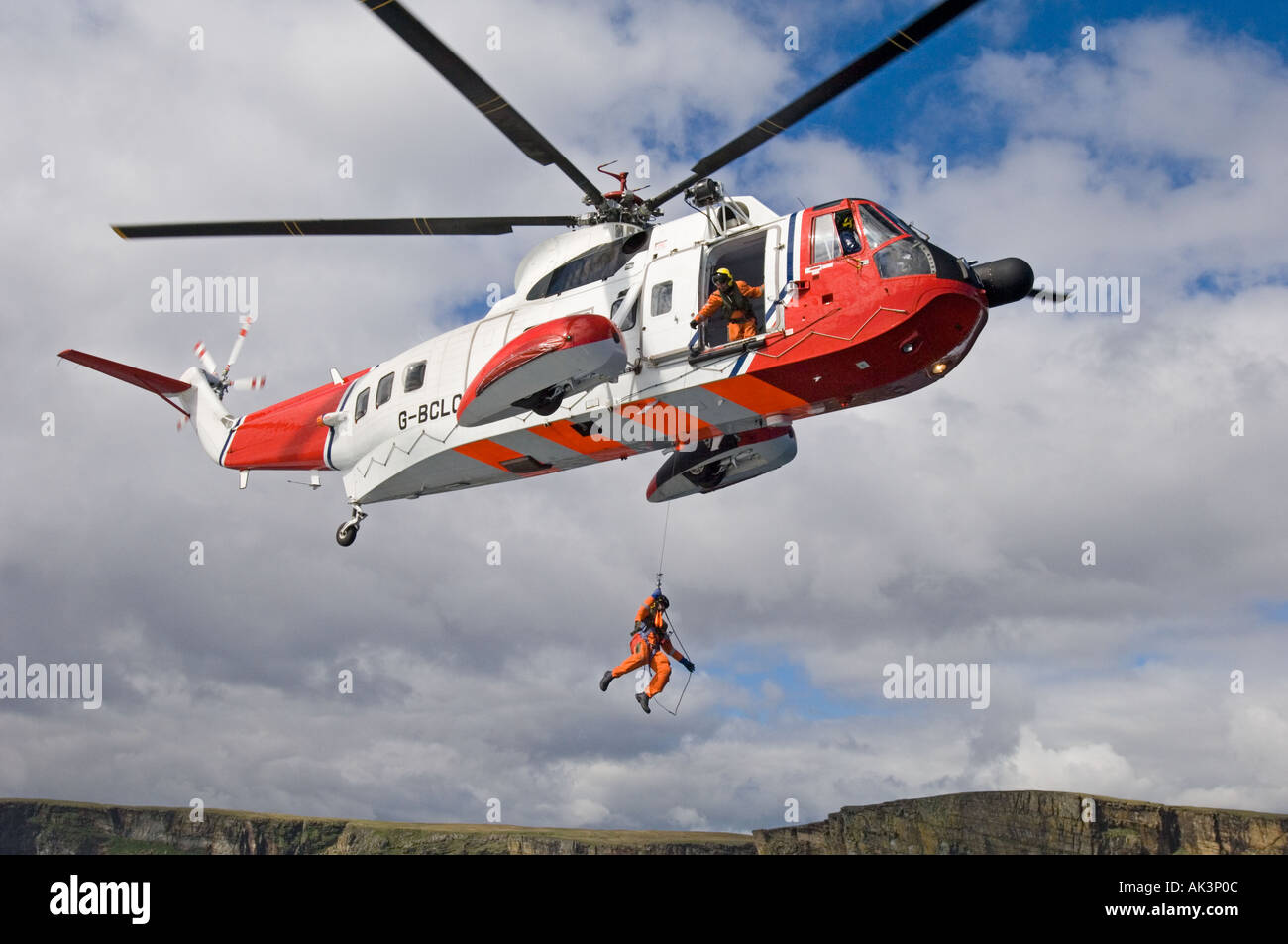 Coastguard Rescue Helicopter winchman being lowered Shetland Scotland UK Stock Photo Alamy