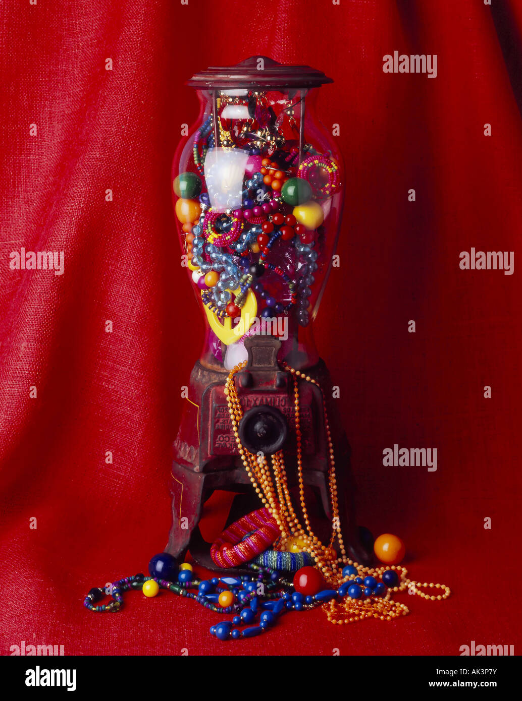 old fashion gum ball machine fill with brightly colored fashion accessories Stock Photo