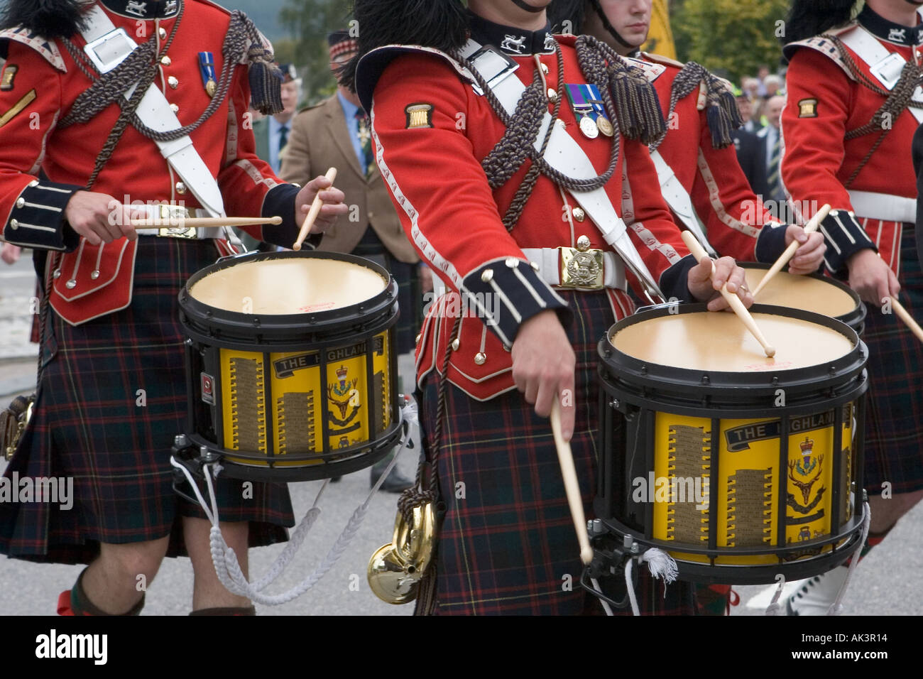 Scottish Highland Games Red coated Drummers in Pipe band playing at