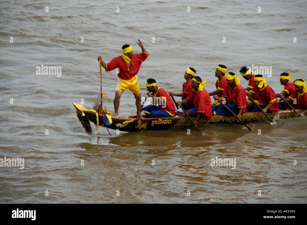 Big rowing boat with many rowers and the leading steering man Water