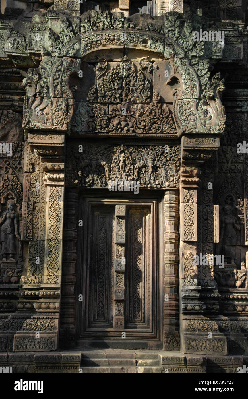 False door with stone relief of fine arts at temple Branteay Srei Angkor Siem Reap Cambodia Stock Photo