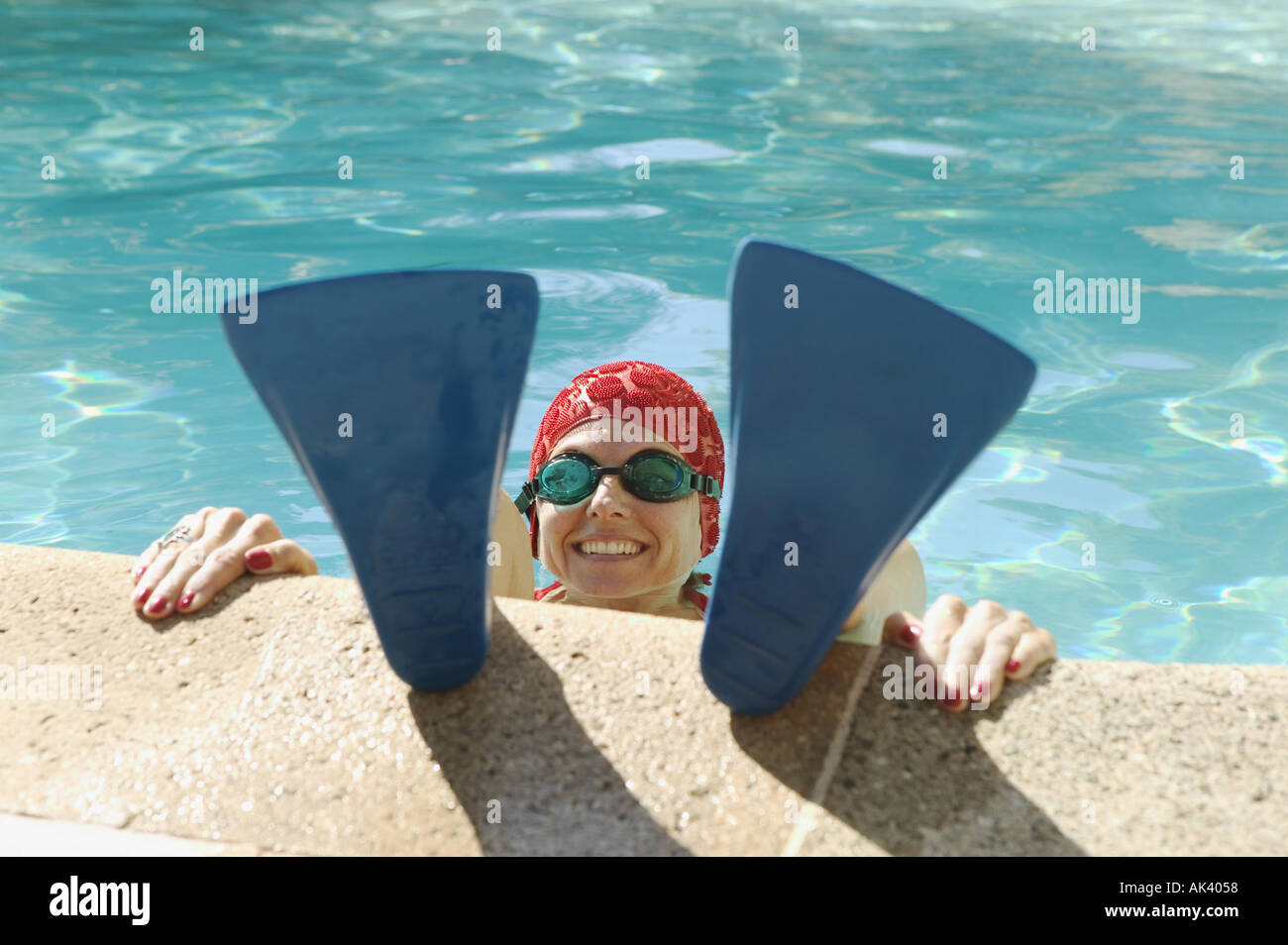 A woman s face between swim fins Stock Photo