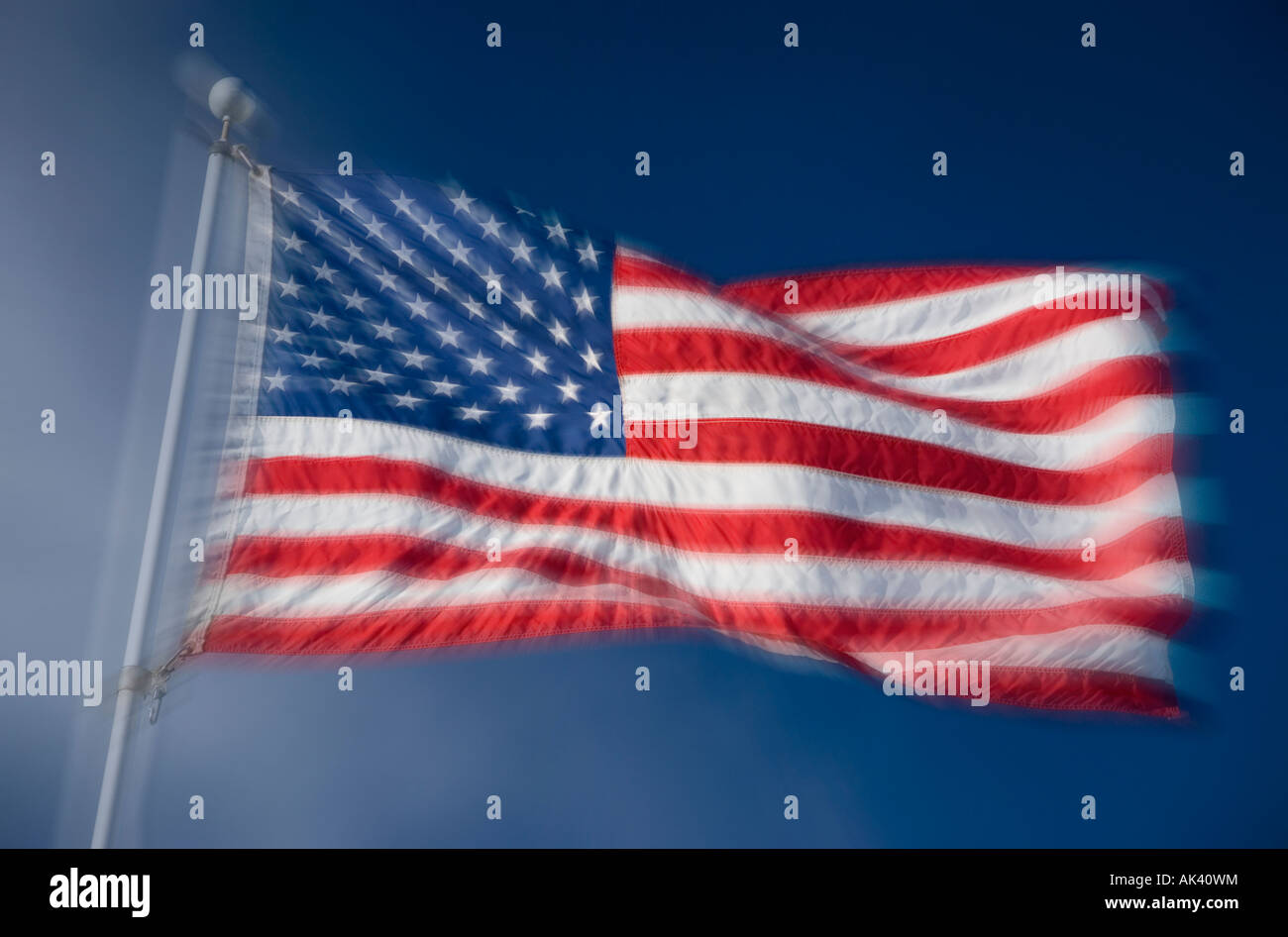 The Stars and Stripes flying against a blue sky Stock Photo - Alamy