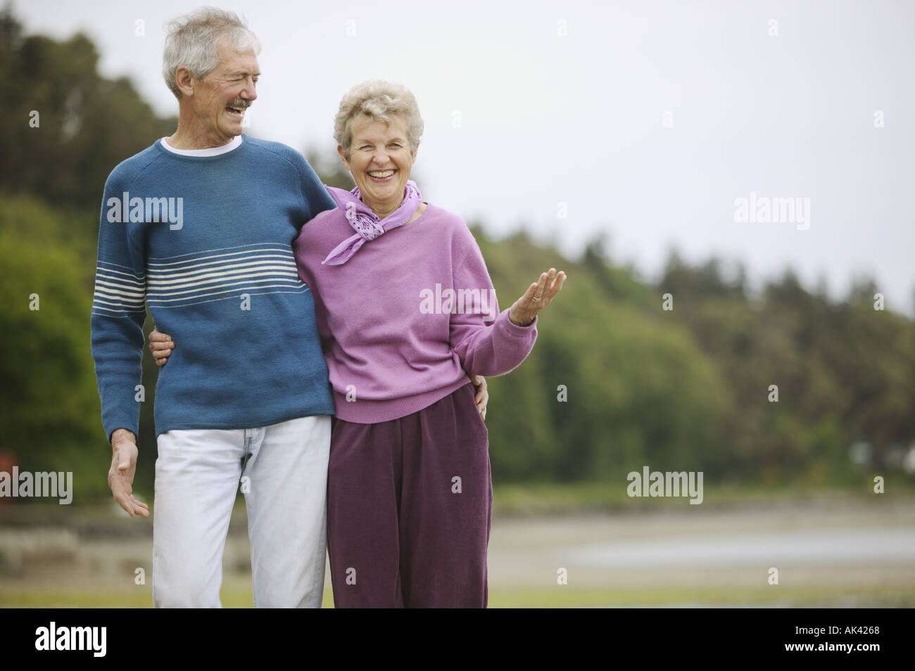 Senior couple laughing at the beach Stock Photo