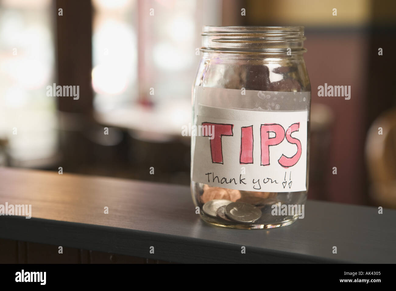 Still life of a nearly empty tip jar Stock Photo