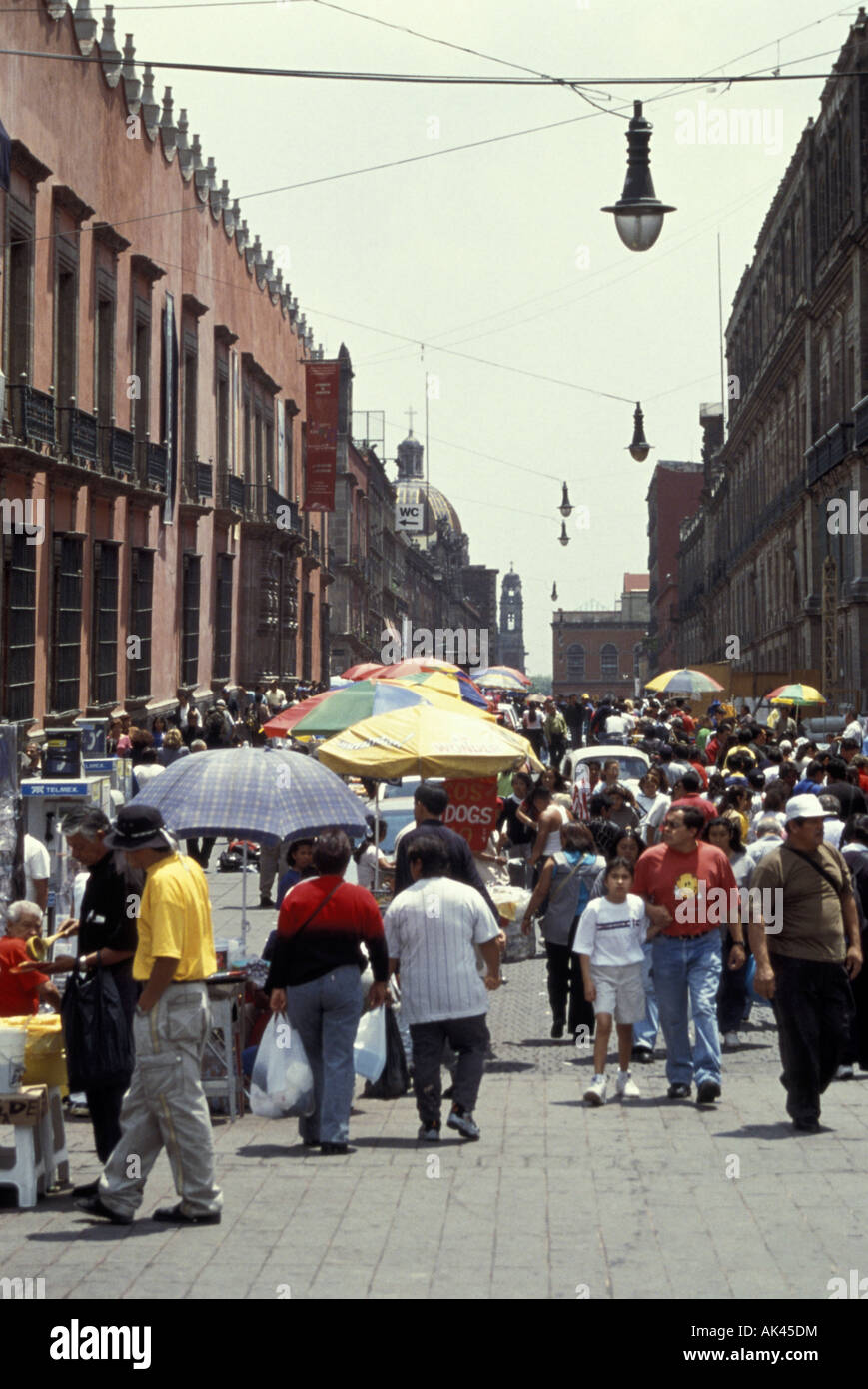 Crowd of people strolling on the Calle Moneda in the Centro Historico, Mexico City Stock Photo