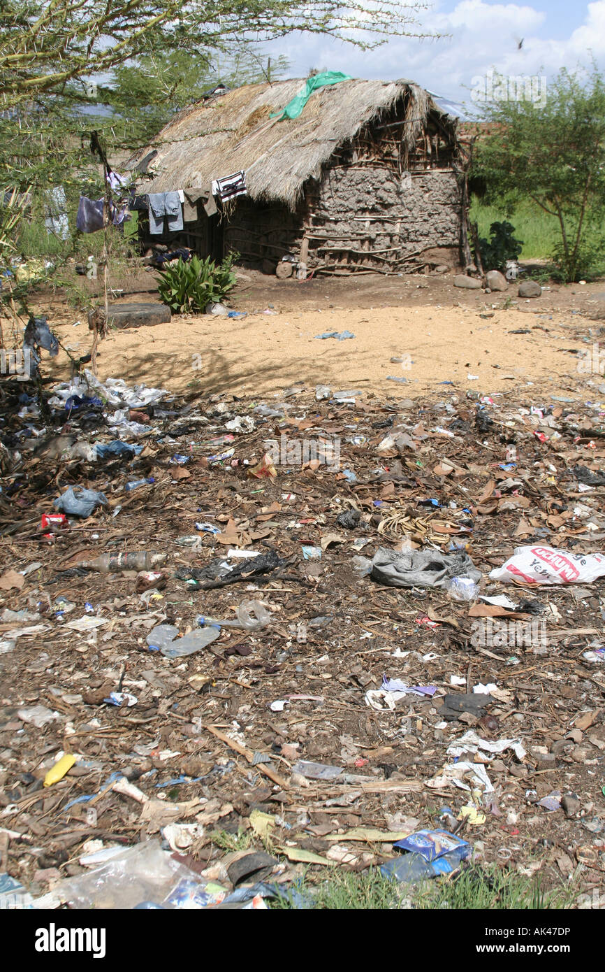 Discarded rubbish and litter washed up after heavy rain outside house