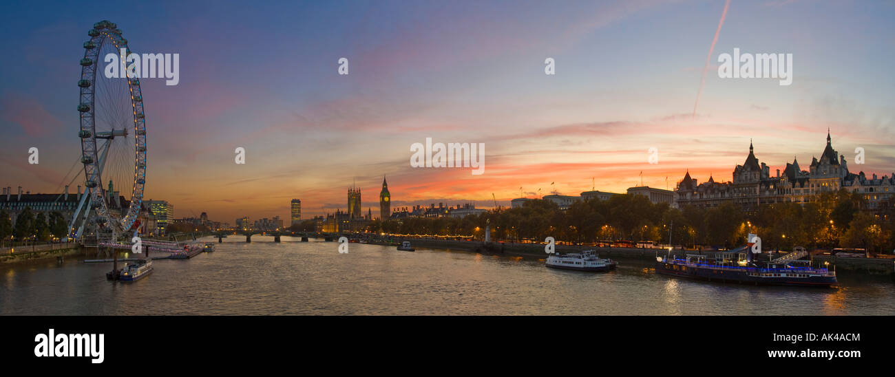 A 3 picture stitch panoramic view of the London Eye, Westminster Bridge and Houses of parliment from Charing X bridge at sunset. Stock Photo