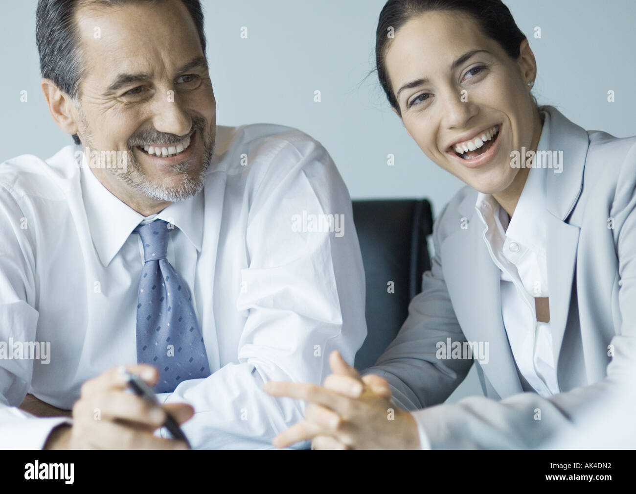 Business colleagues working together, smiling Stock Photo