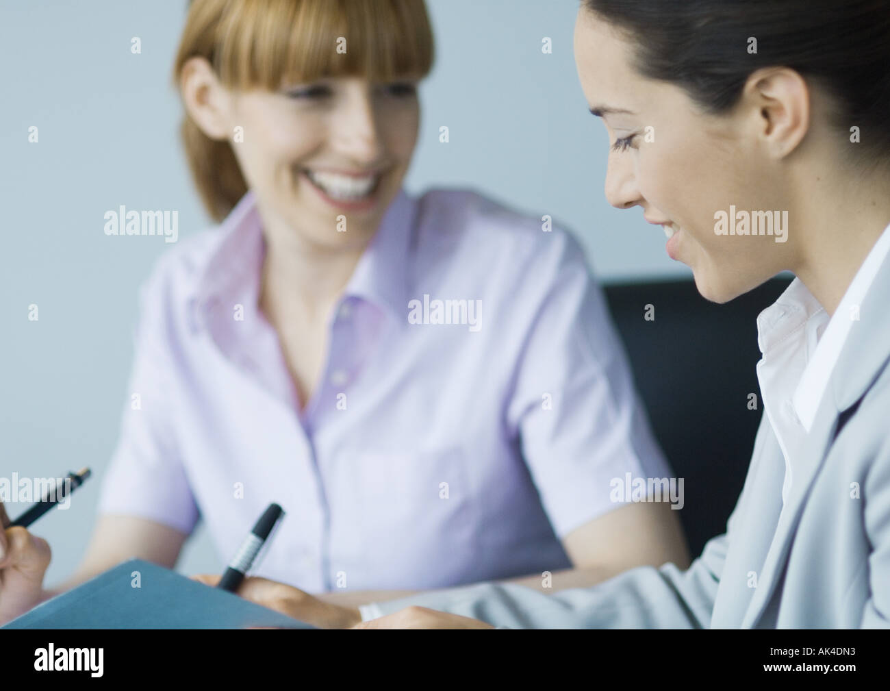 Business colleagues working together, smiling Stock Photo