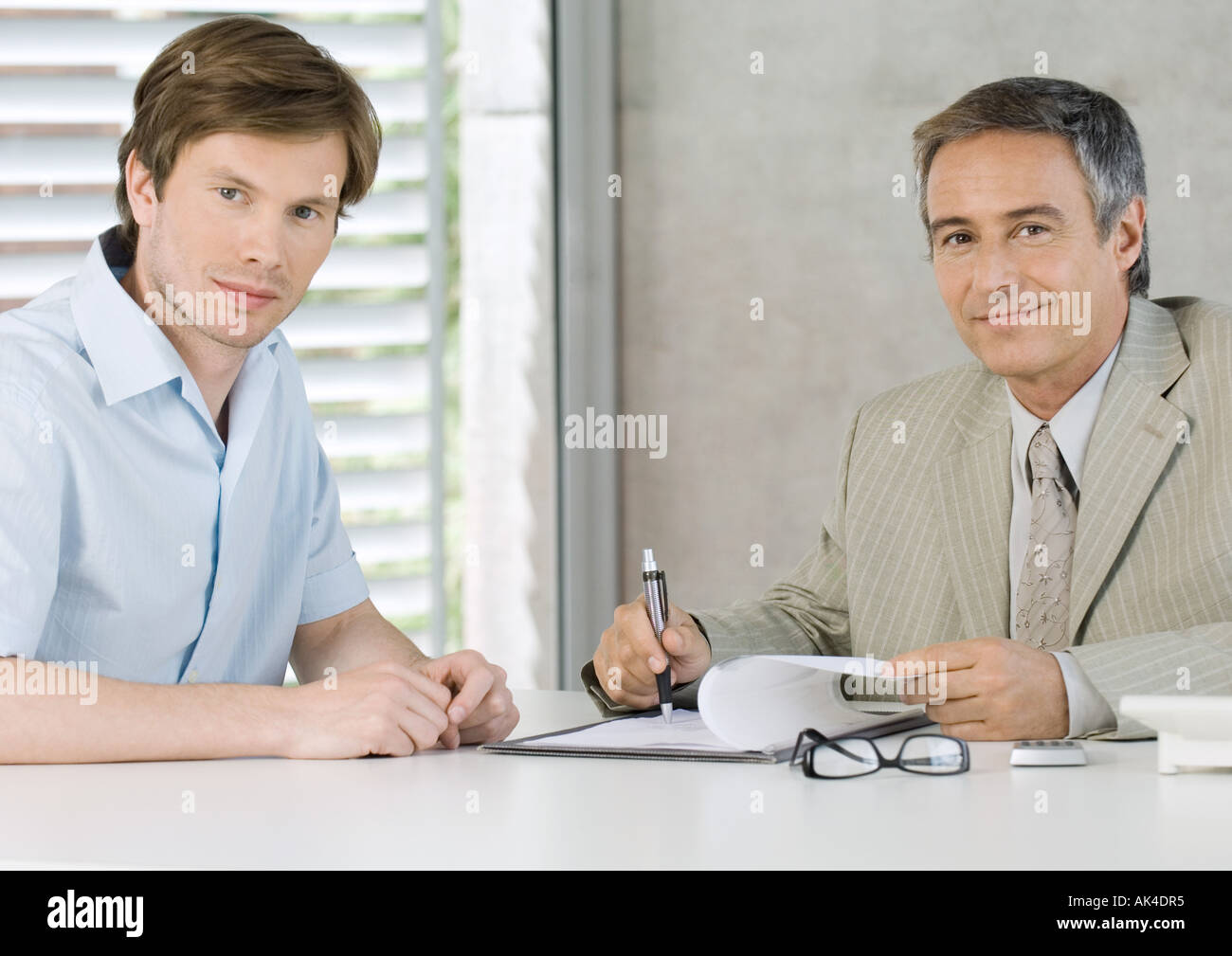 Side view mature man sitting hi-res stock photography and images - Alamy