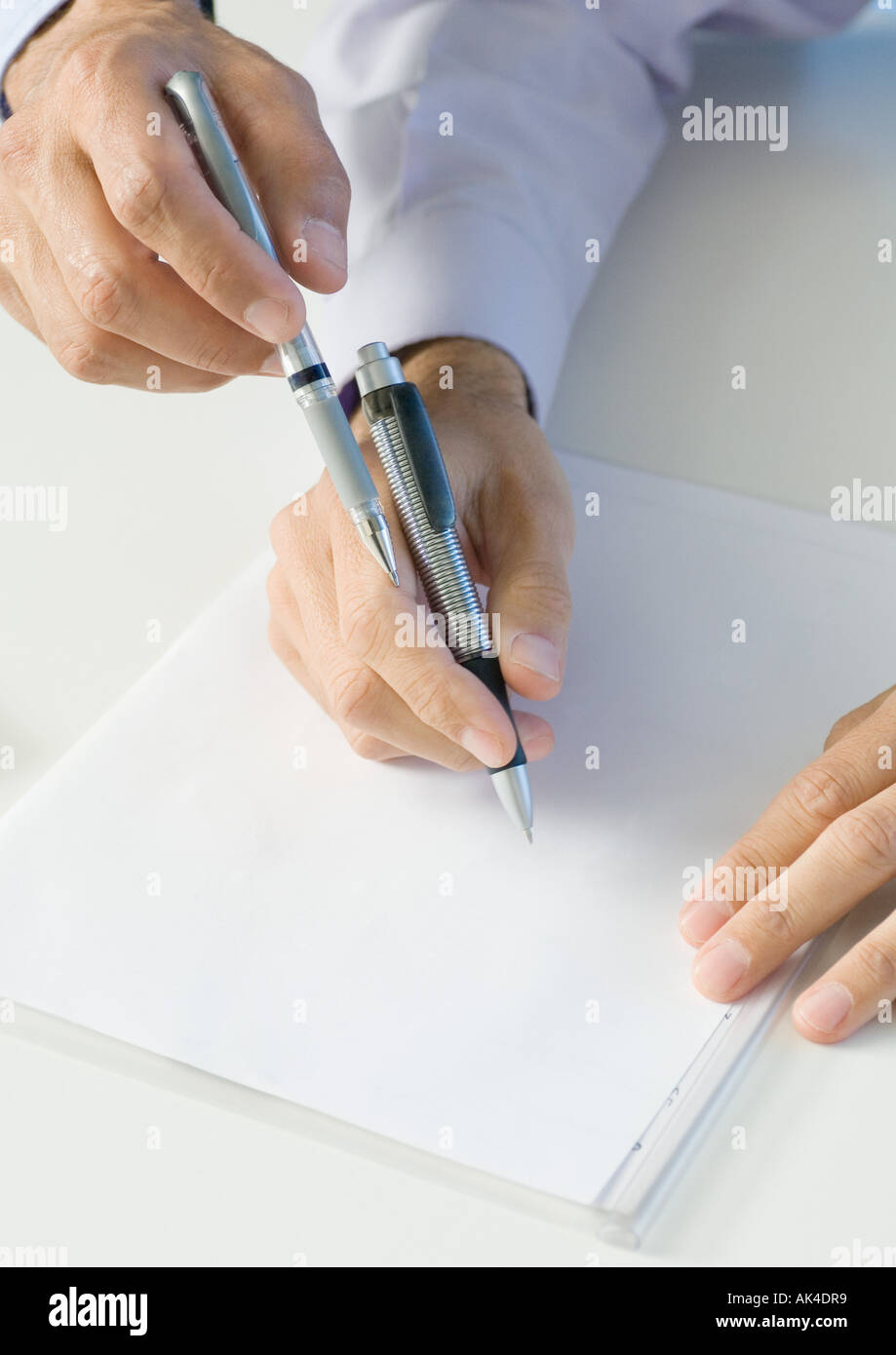 Holding Pens High Resolution Stock Photography and Images Alamy