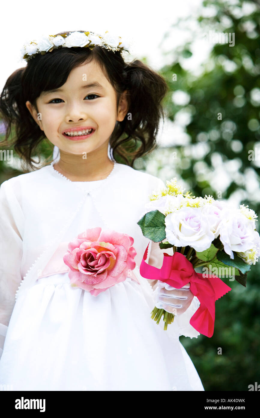 Portrait of flower girl, smiling Stock Photo - Alamy