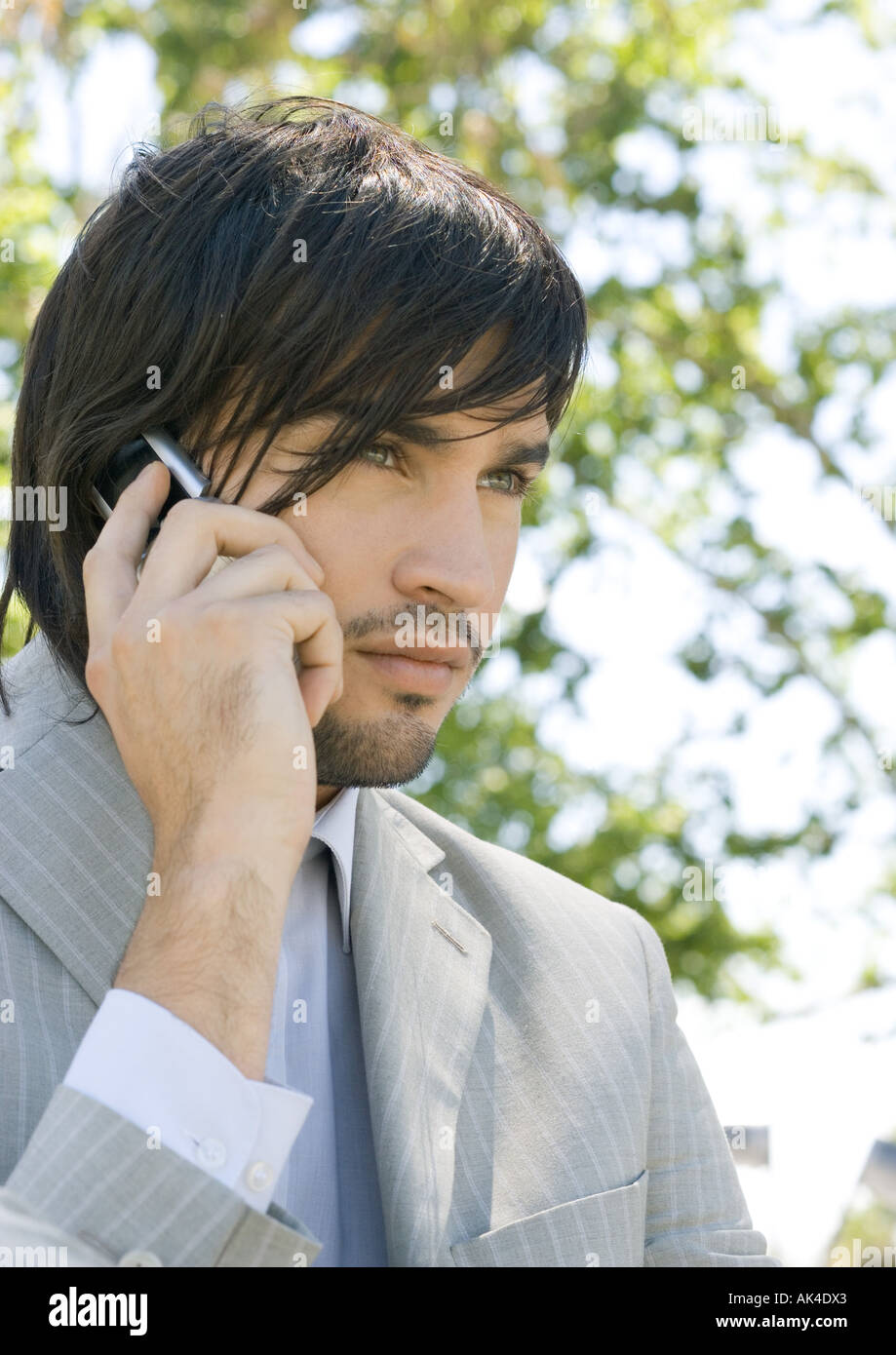 Young businessman using cell phone Stock Photo