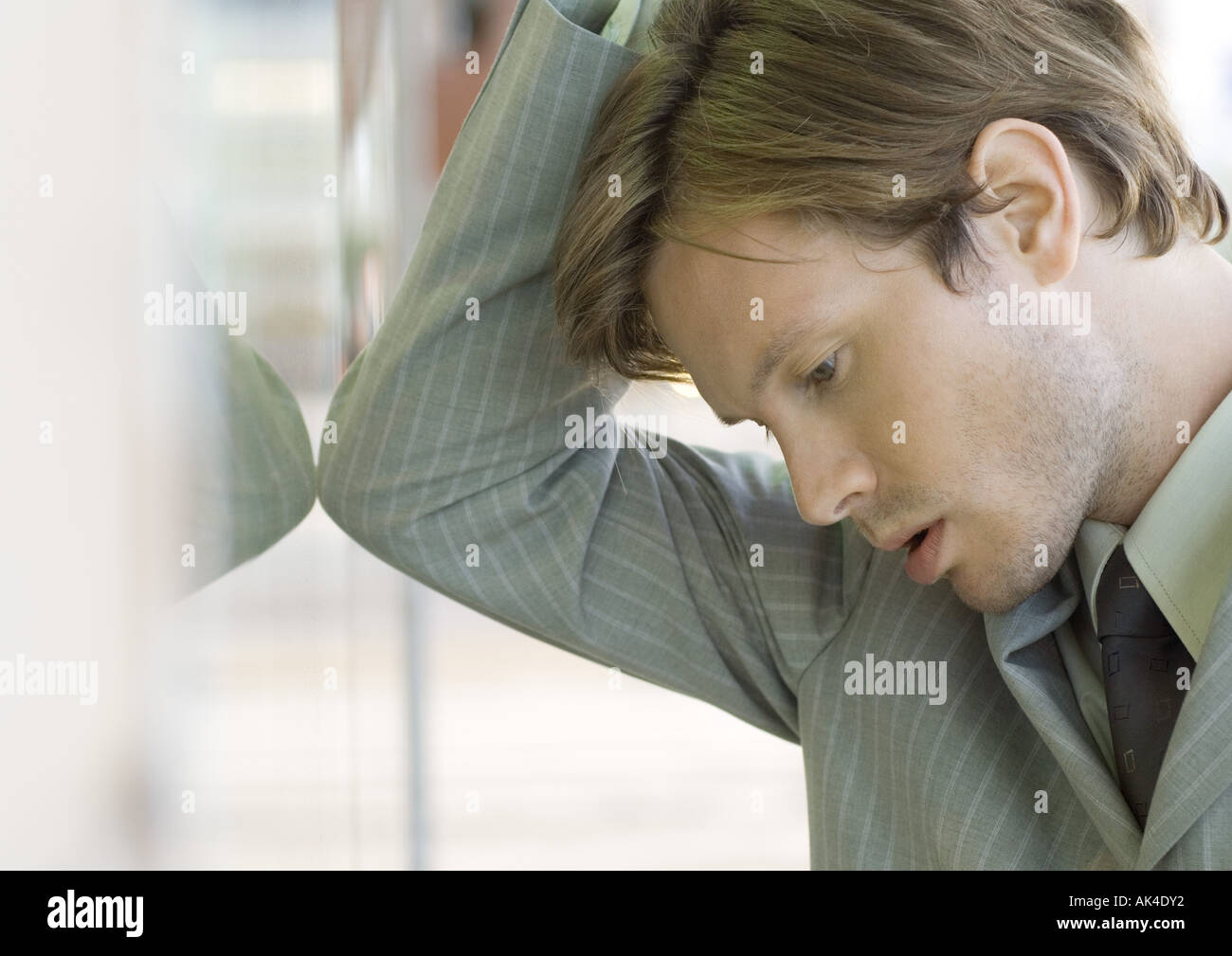 Young businessman with head down Stock Photo