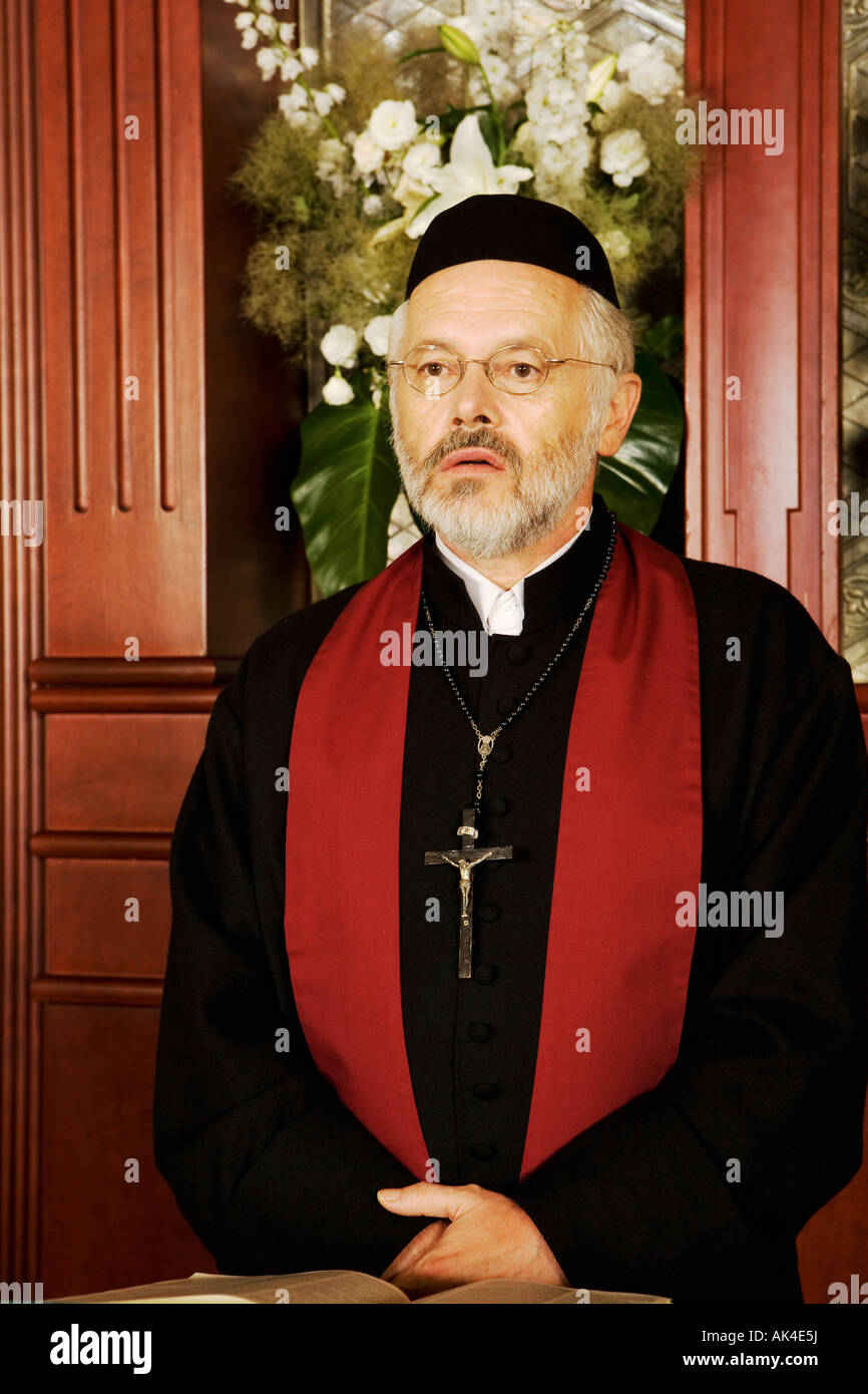 Portrait of minister in church Stock Photo - Alamy