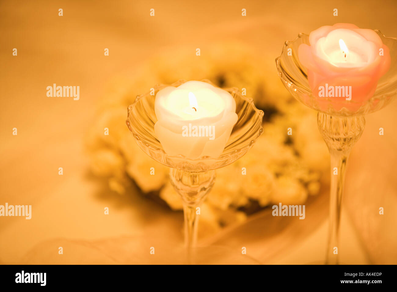 Two candles on candlestick holders Stock Photo Alamy