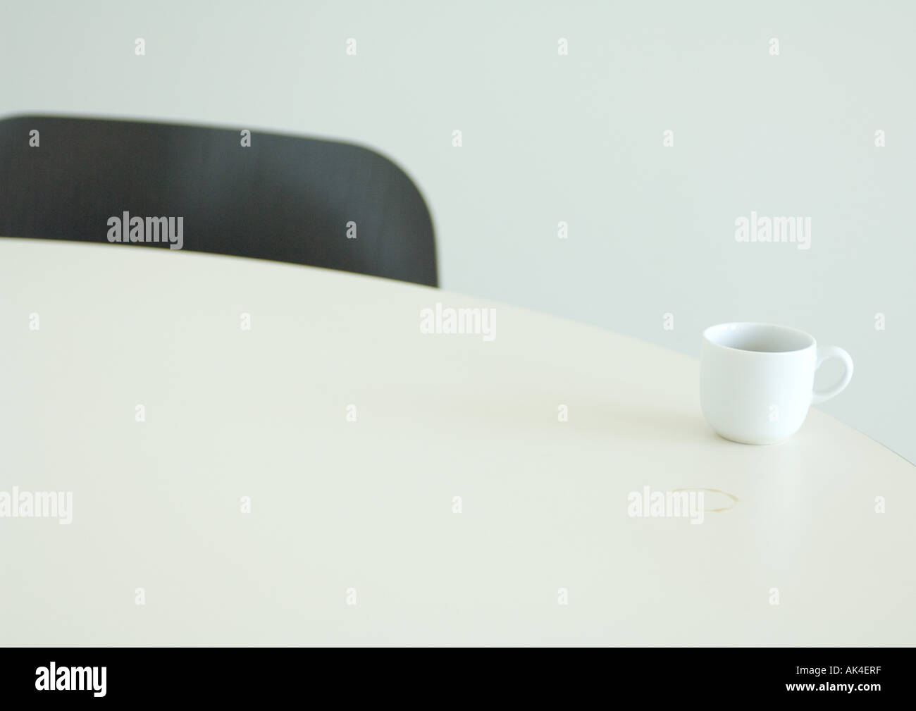 Coffee cup on edge of table Stock Photo Alamy