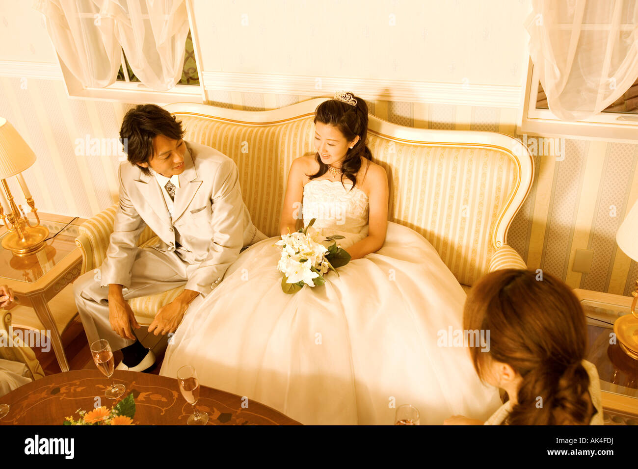 Bride and groom relaxing with friends, top angle view Stock Photo