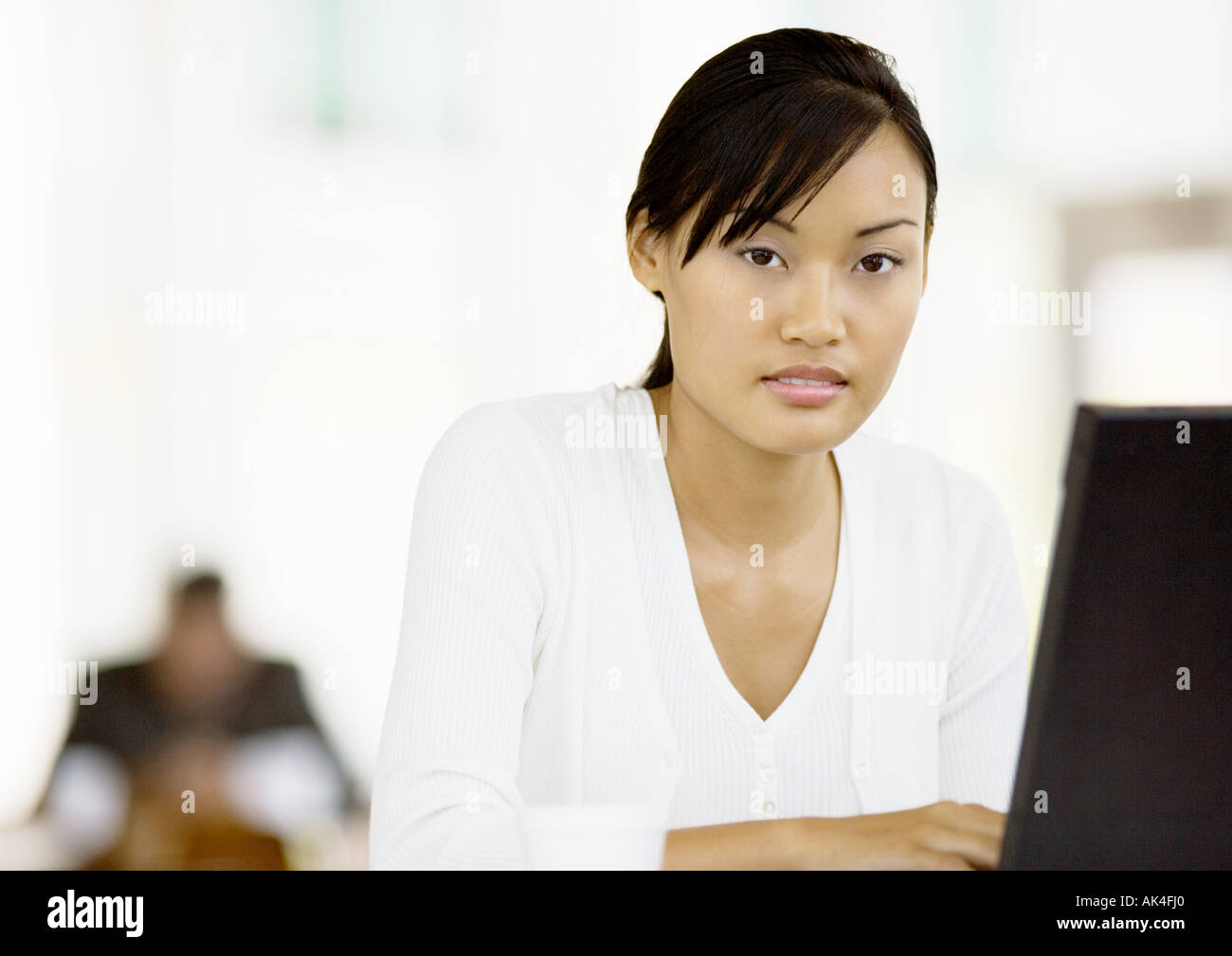 Young woman using laptop Stock Photo