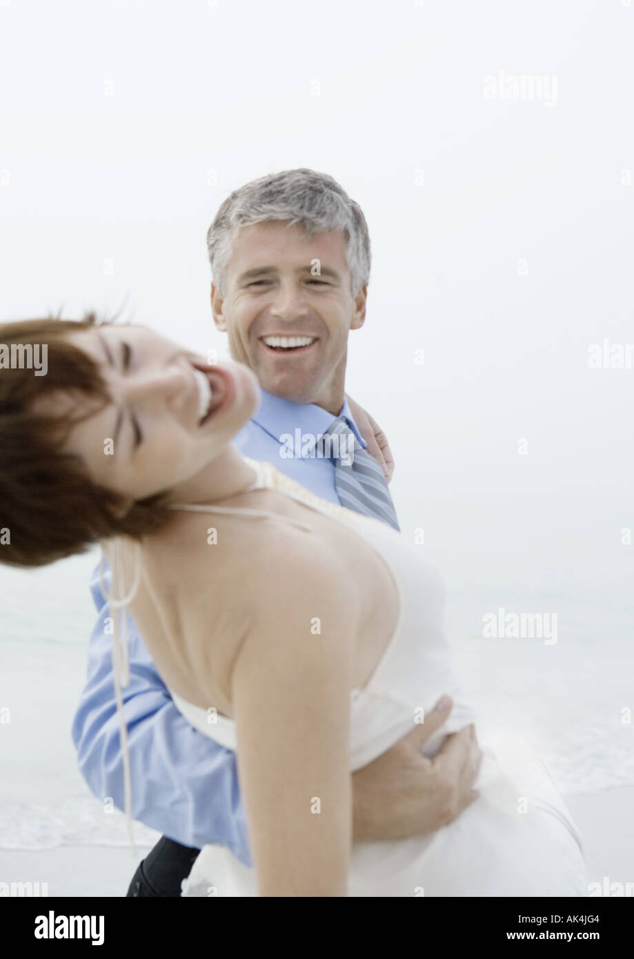 Couple dancing on beach Stock Photo - Alamy