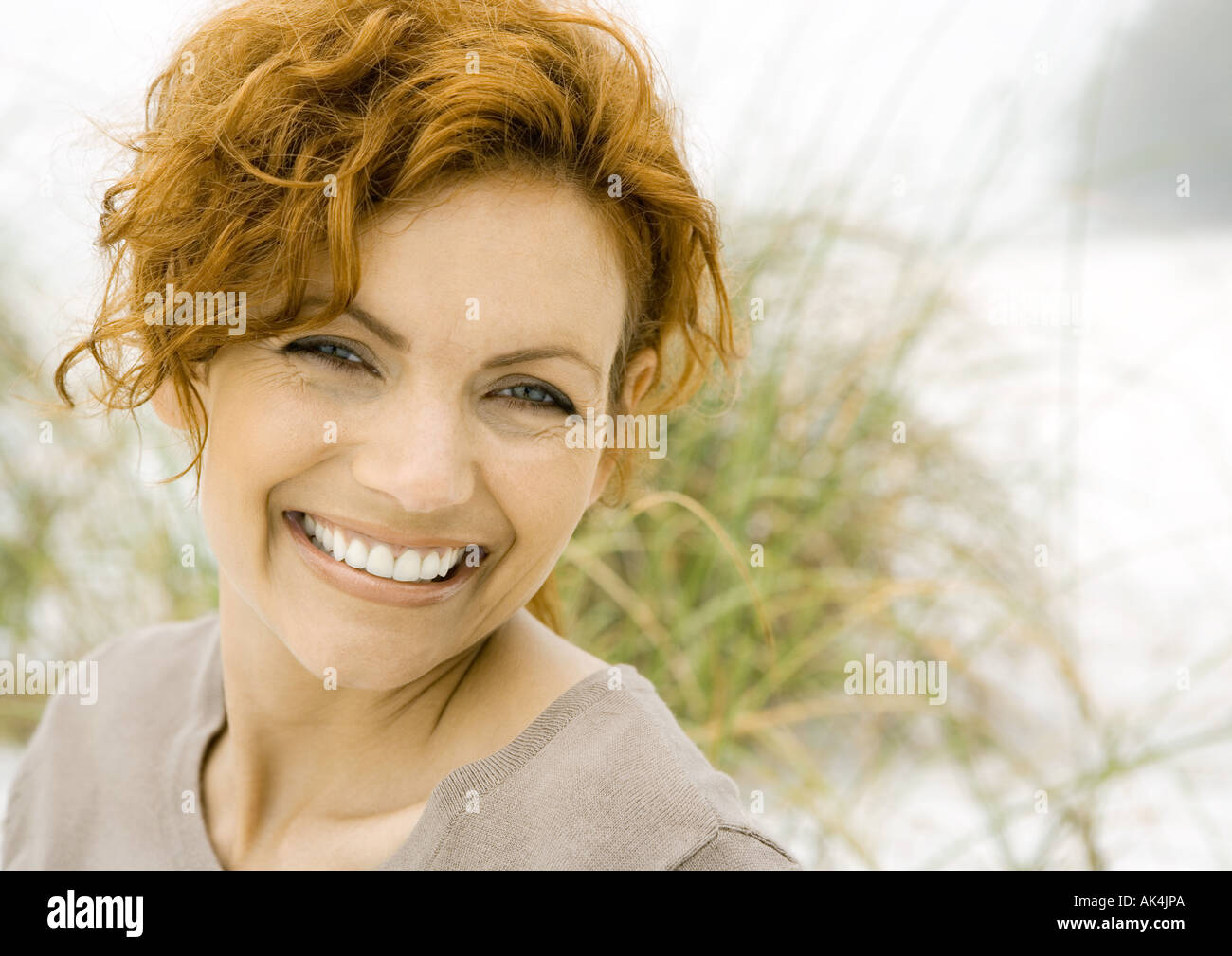 Woman smiling at camera Stock Photo