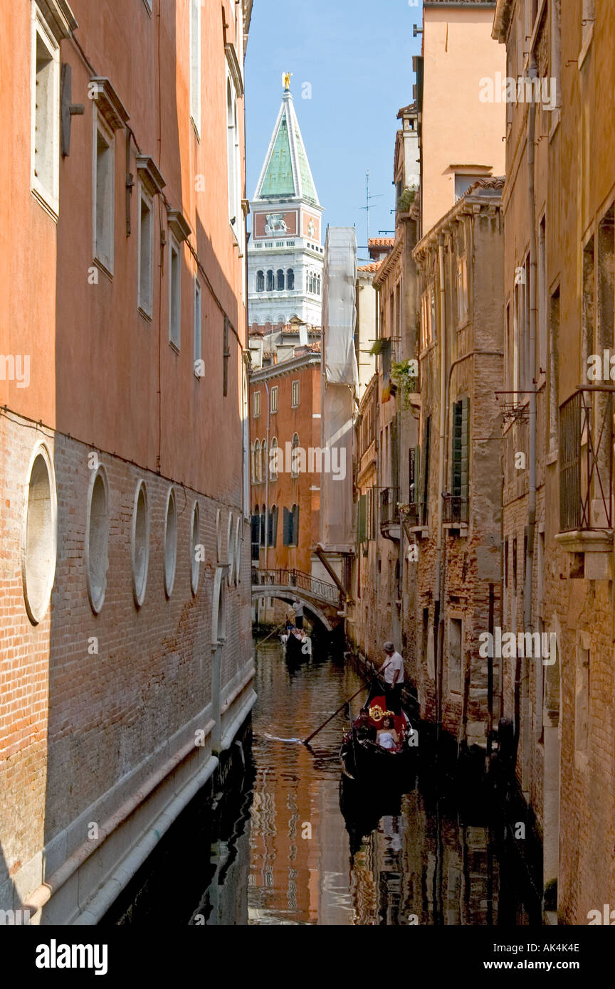 In the canals of Venice with San Marcus clock tower in the background ...