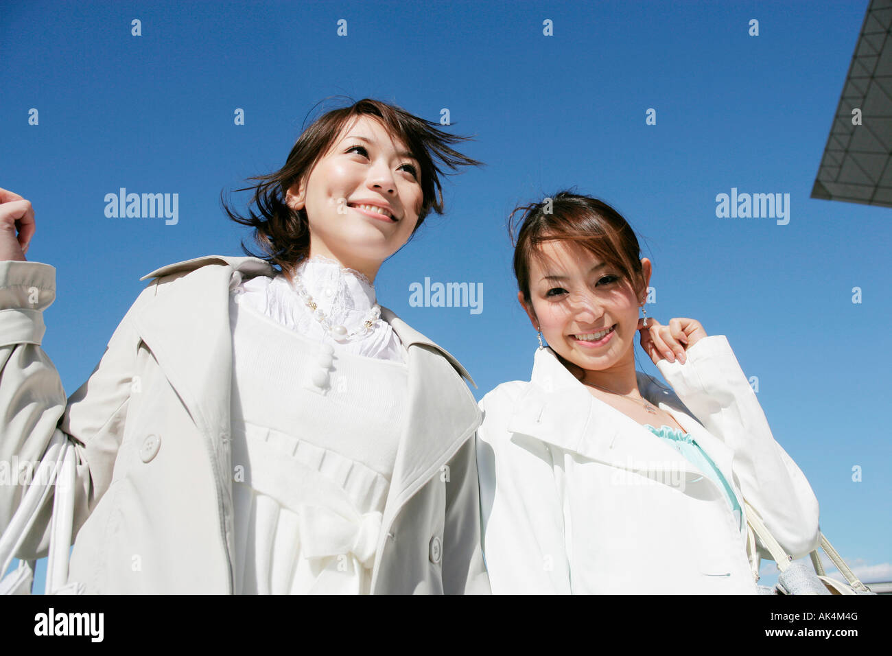 Two women, smiling, low angle Stock Photo