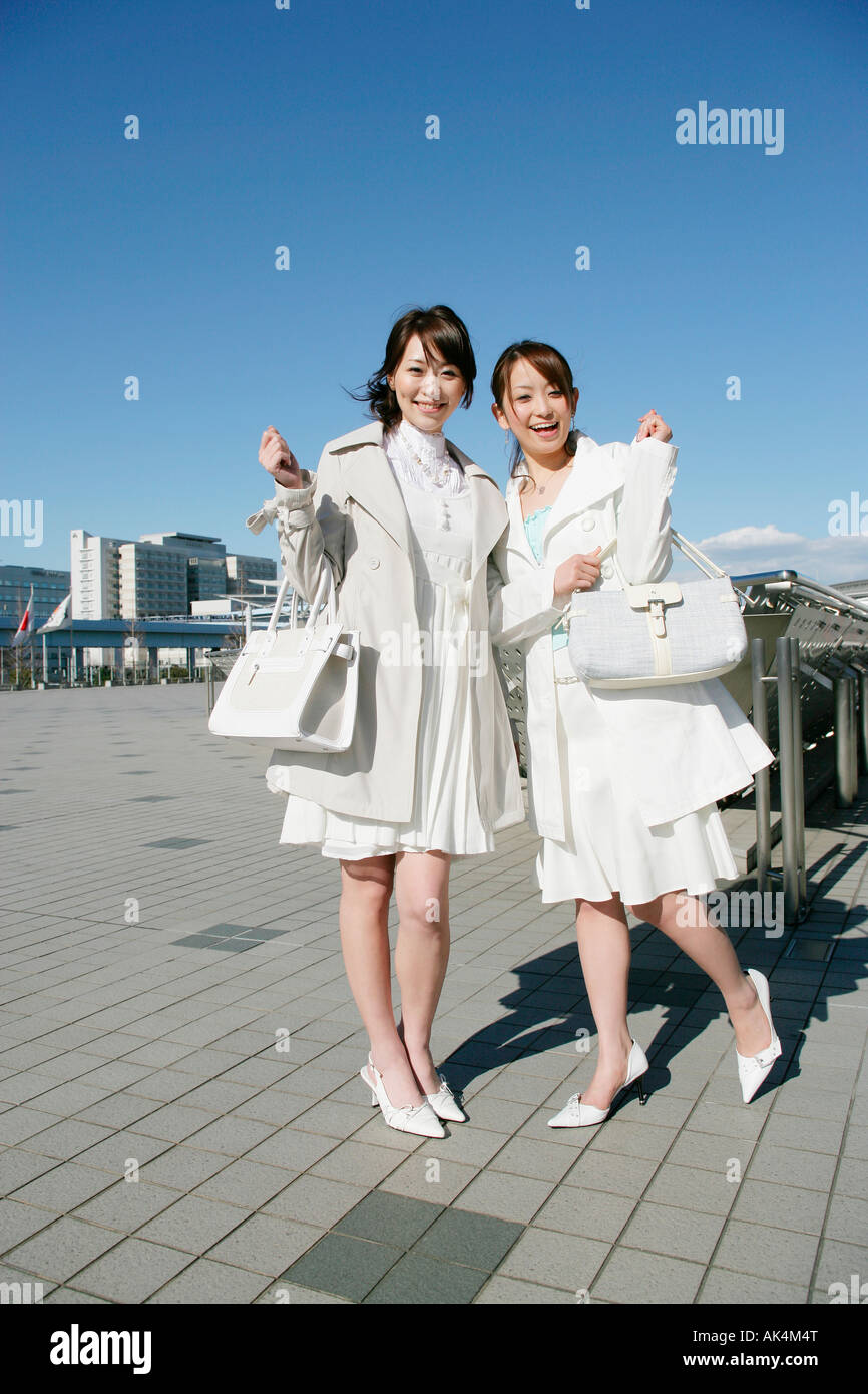 Two women standing together hi-res stock photography and images - Alamy