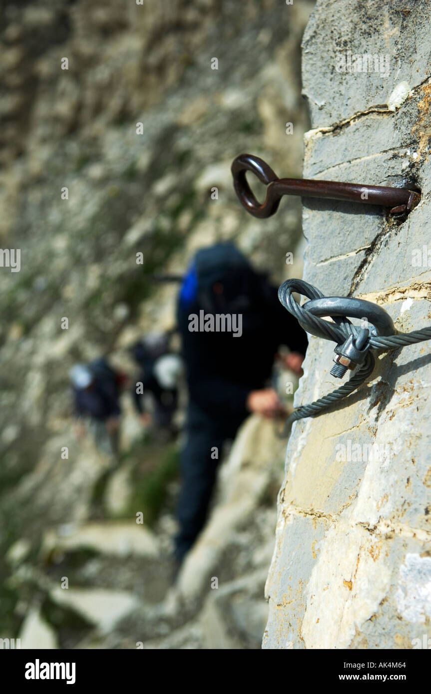 steal hooks fastend in the rock wire rope wire cable mountain climber