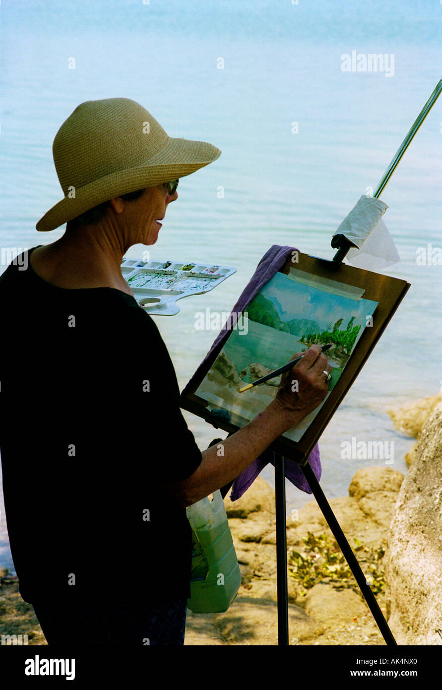 At a lakeside location in Provence, an artist painting the scene Stock Photo