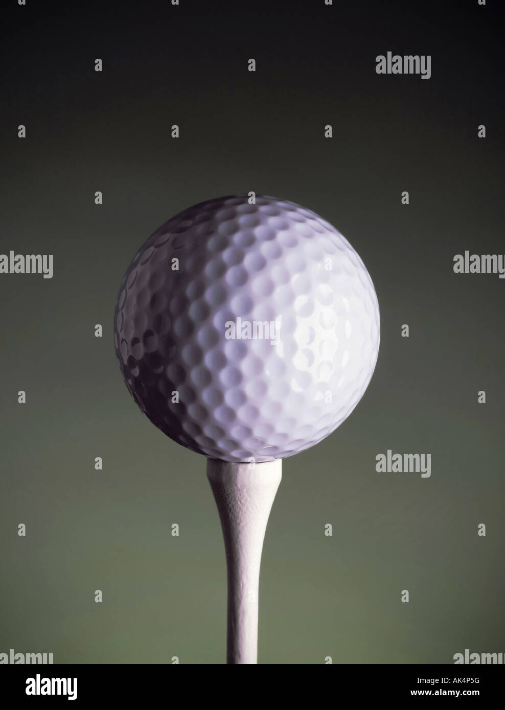 golf ball on tee Stock Photo
