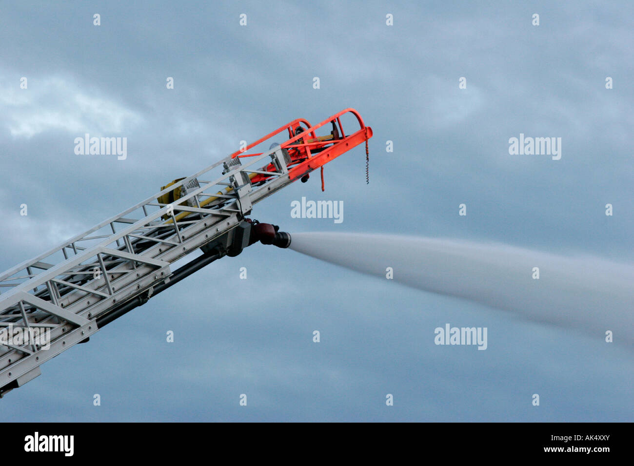 Extended ladder spraying water from the nozzle Stock Photo Alamy