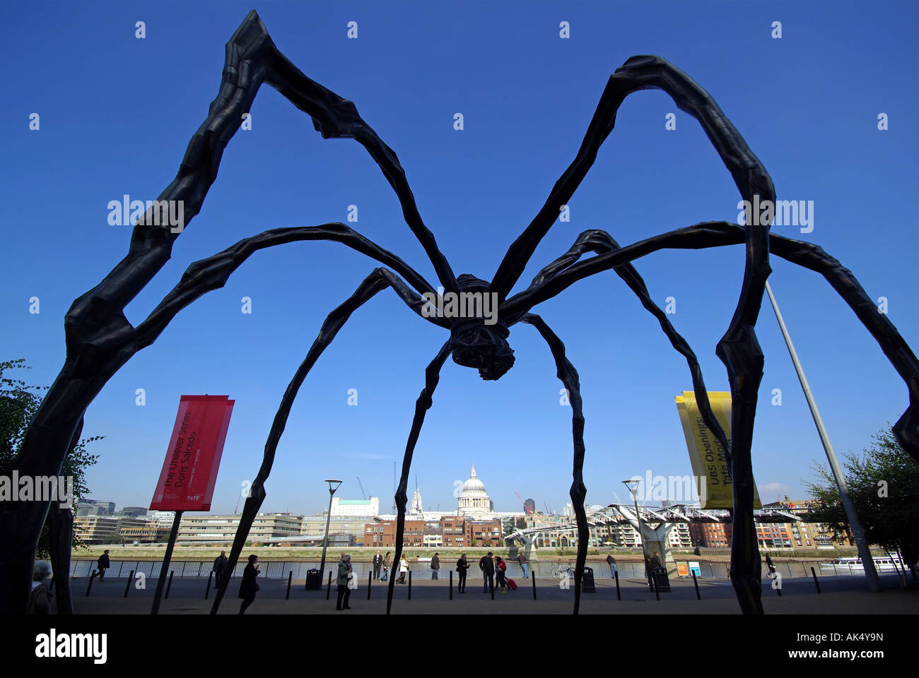 Maman Spider sculpture at  London Tate Modern forming a frame for Dome of St Pauls cathedral and City of London skyline beyond Stock Photo
