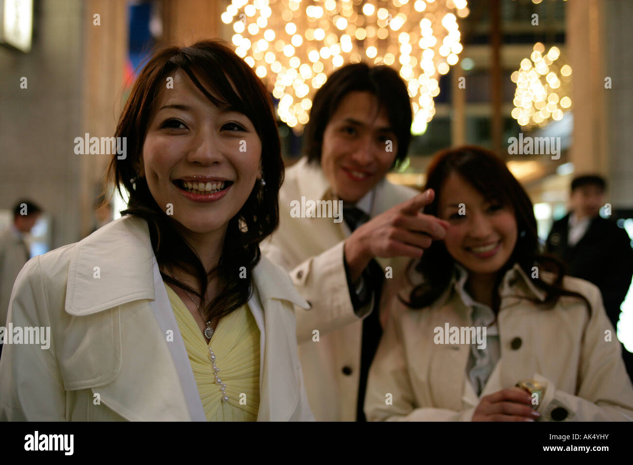 Businessman and two women on the street at night Stock Photo - Alamy