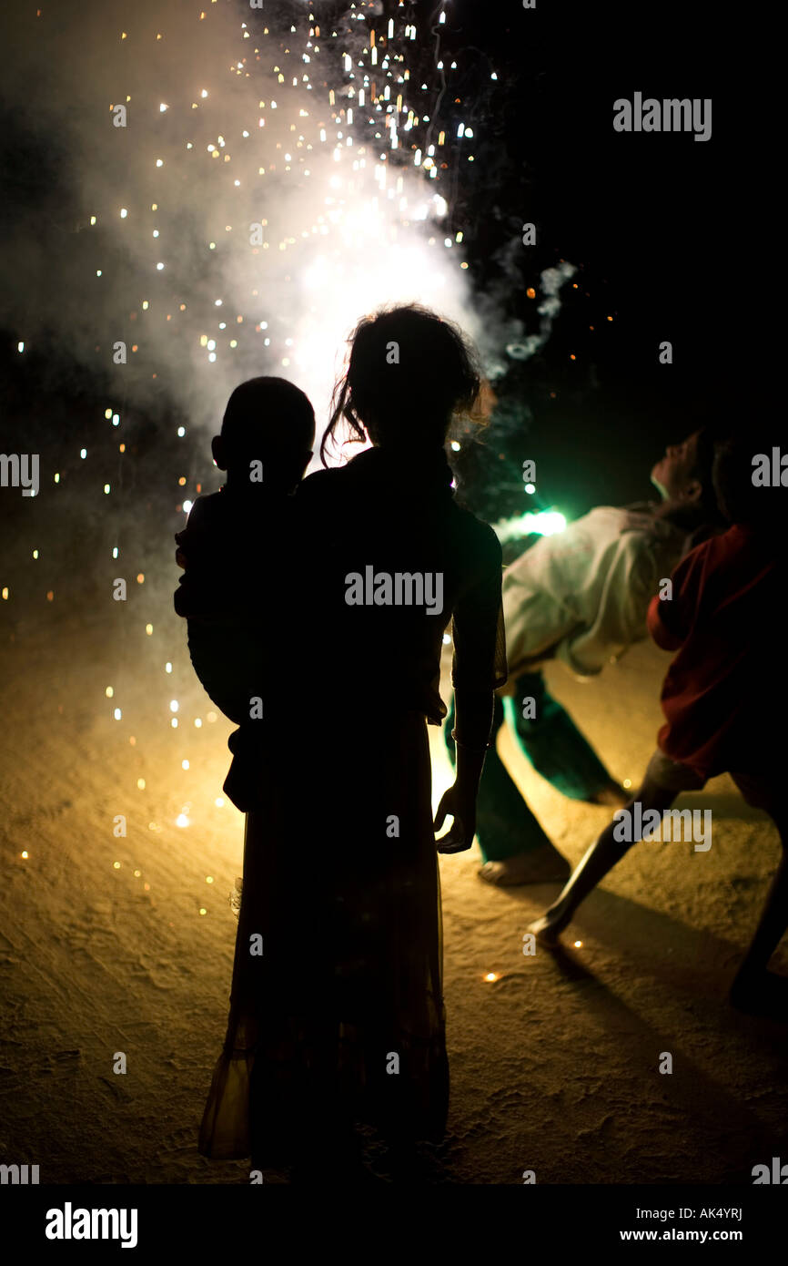 Indian children playing around fireworks at Diwali on an indian street Stock Photo