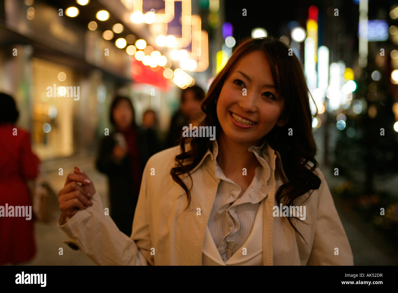 Woman walking on street at night, close-up Stock Photo - Alamy