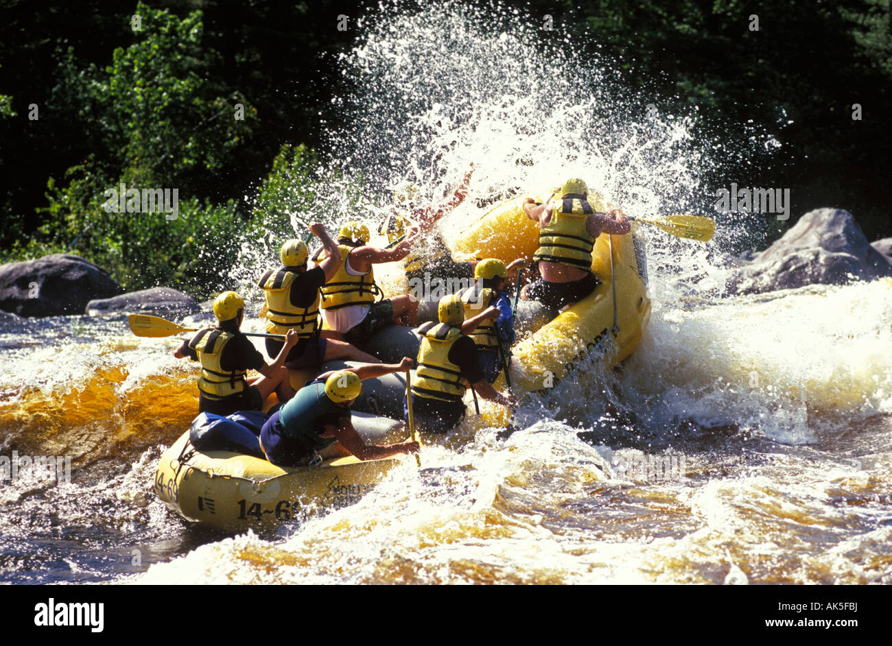 Group of eight people rafting on Class IV rapids Penobscot River Maine