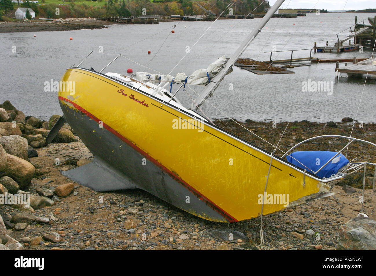 Damaged yacht laying on side on beach broken mooring Chester Tropical Storm Noel Nova Scotia Canada North America Stock Photo