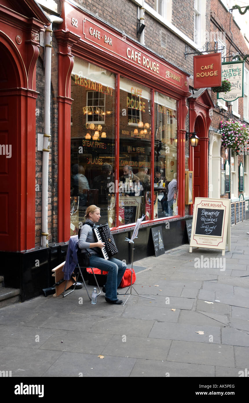 Accordion player outside french cafe in York Stock Photo Alamy