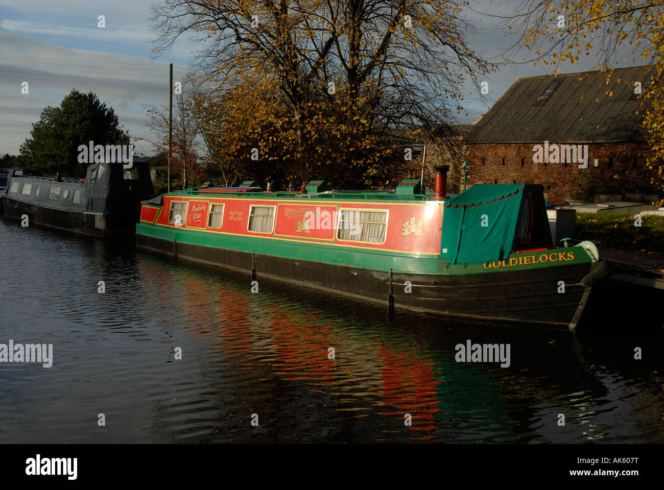 A narrowboat tied up on the Leeds Liverpool canal Stock Photo